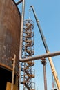 Repair work on replacement of lower belts of old rusty tank for Royalty Free Stock Photo