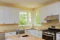 Installation of kitchen cabinets with beautiful furniture such as drawers in a new house Royalty Free Stock Photo