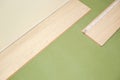 Installation laminate or parquet in the room, worker installing wooden laminate flooring, marking the length of the Royalty Free Stock Photo