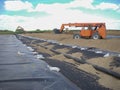 Installation of a leachate collection system under a new landfill with a liner and perforated rock. Royalty Free Stock Photo