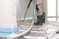 installation of liquid concrete on the floor for underfloor heating