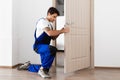 Installation of a lock on the entrance door Royalty Free Stock Photo