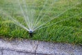 Installation modern garden irrigation system watering lawn