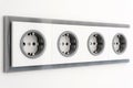 Installation modern sockets on a painted wall close-up. Grey and white electrical outlet.