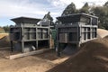 installation of a new composting system, with close-up view of the bins and mixers