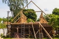 Installation of a new wooden roof on a dwelling house by a team of joiners and roofers