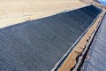 Installation process of geosynthetics in industry and mining Royalty Free Stock Photo