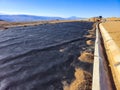 Installation process of geosynthetics in industry and mining Royalty Free Stock Photo