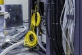 Installation of server equipment in the data center, a coil with a cable and coils of wires connect the clusters in the