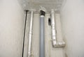 Installation of sewer pipes in a bathroom of an apartment interior during renovation works. Gray plastic drain pipe for used water Royalty Free Stock Photo