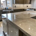 Installation of Sleek New Countertops in a Modern Kitchen, the Key Stage of the Renovation Royalty Free Stock Photo