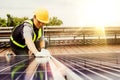 Installation of solar panels and inspecting them by engineers.