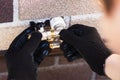 Installation of taps for water outside the house. Water supply, installation and repair services. Close-up - the hands