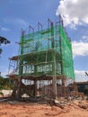 Installation of temporary scaffolding for the construction of tall concrete structures.