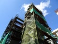 Installation of temporary scaffolding for the construction of tall concrete structures.