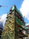 Installation of temporary scaffolding for the construction of tall concrete structures.