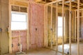 An installation of thermal fiberglass insulation mineral rock wool in a new home Royalty Free Stock Photo