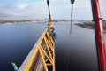 Installation of tower crane on construction site, workers steeplejacks working.