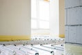 Installation of underfloor heating pipes for water heating. Heating systems. Pipes for underfloor heating. Royalty Free Stock Photo
