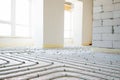 Installation of underfloor heating pipes for water heating. Heating systems. Pipes for underfloor heating. Royalty Free Stock Photo