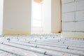 Installation of underfloor heating pipes for water heating. Heating systems. Pipes for underfloor heating. Royalty Free Stock Photo