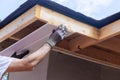 An installation of upvc soffit board at corner of a roof rafters ceiling Royalty Free Stock Photo