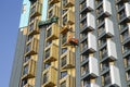 Installation of a ventilated facade in an apartment building under construction. Building insulation Royalty Free Stock Photo