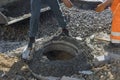 Installation of a water sewer well in the ground includes a cast iron sewer hatch