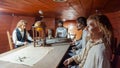 Installation of wax figures of the crew of an old sailing ship in the hold of the ship museum