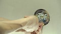 Installation wire into a plug. A man installs an electrical outlet in the wall. Close up of technician holding screwdriver near po