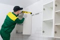 The installation wizard, kitchen storage systems, sets the correct level of the upper cabinet