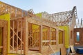 Installation of wooden beams at construction of frame house photo of a new home under construction Royalty Free Stock Photo