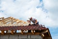 Installation of a wooden roof and Closing the roof with Onduvilla bituminous tiles. Woods elements and components of the Royalty Free Stock Photo