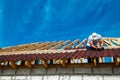 Installation of a wooden roof and Closing the roof with Onduvilla bituminous tiles. Woods elements and components of the Royalty Free Stock Photo