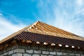 Installation of a wooden roof and Closing the roof with Onduvilla bituminous tiles. Woods elements and components of the Royalty Free Stock Photo