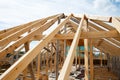 Installation of a wooden roof. Preparation Closing the roof with bituminous tiles. Woods elements and components of the Royalty Free Stock Photo