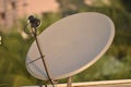 Installed dish or DTH or Direct to home tv on the roof against blur background, which is used for receiving TV programs