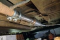 Installed a new exhaust pipe with resonator on bottom old car Royalty Free Stock Photo