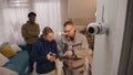 Installer sets up security cam for family