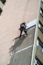 Installer on the wall of a high-rise building