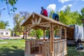 Installers build a pavilion of wood material