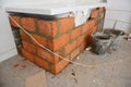 Installing bathtub.Bathtub installation with bricks in house bath room Royalty Free Stock Photo
