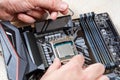 Installing a blank central processor on a motherboard. The blank CPU is installed in the motherboard connector. DIY PC Royalty Free Stock Photo