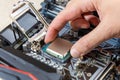 Installing a blank central processor on a motherboard. The blank CPU is installed in the motherboard connector. DIY PC Royalty Free Stock Photo