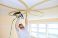 Installing ceiling moldings in the interior handyman using gauge finish nailer