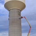 Installing cellular antennas on a water tower Royalty Free Stock Photo