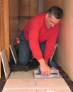 Installing ceramic tile Royalty Free Stock Photo