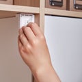 Installing a child-proof magnetic lock to protect cabinet doors and dra