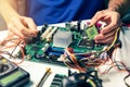 Installing computer hardware - technician install CPU on motherboard Royalty Free Stock Photo