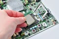 Installing a computer processor into a motherboard socket for upgrade or repair Royalty Free Stock Photo